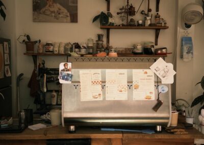 Vintage-style coffee bar with warm decor, menus, and memorabilia.